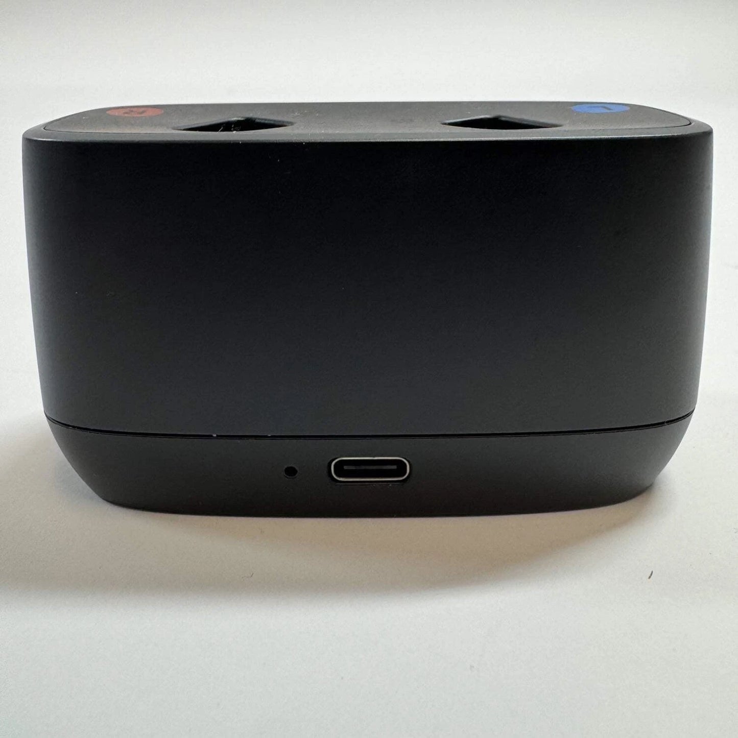 Black electronic device with multiple ports on a white background
