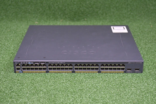 Cisco network switch on a green grass background