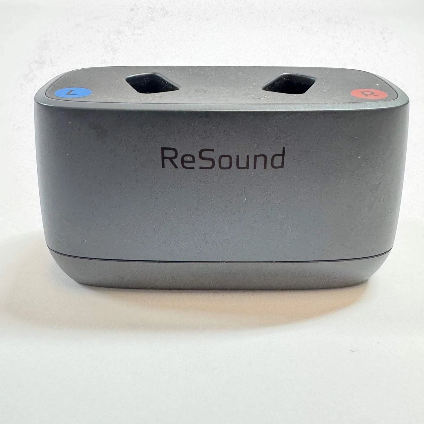 Gray electronic device with 'ReSound' branding on a white background