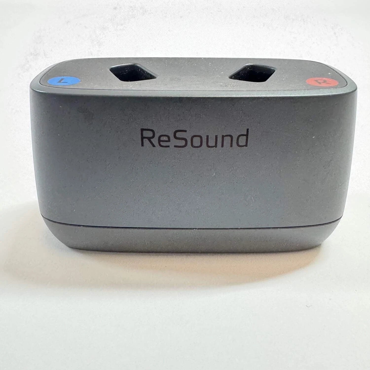 Gray electronic device with 'ReSound' branding on a white background